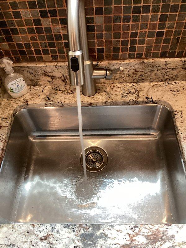 Completed tanked water heater flush as part of routine plumbing maintenance to remove sediment buildup and ensure optimal performance. Additionally, addressed a loose faucet handle in the kitchen, tightening the mounting hardware to restore proper operation. All fixtures tested and confirmed functioning correctly upon completion.