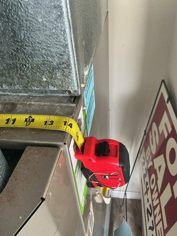 Responded to no cooling complaint and performed system evaluation. Upon inspection, found existing air conditioning system failing and unable to maintain proper cooling capacity. Provided estimate for complete HVAC system replacement. Documented existing equipment conditions including excessive condensation on indoor components indicating potential airflow restrictions and system inefficiencies. Measured and photographed indoor unit showing significant moisture accumulation on metal surfaces. Exterior condenser unit assessed and photographed showing current installation configuration with electrical connections and refrigerant line routing along exterior wall. Presented replacement options to address cooling failure and restore climate control functionality to residence.