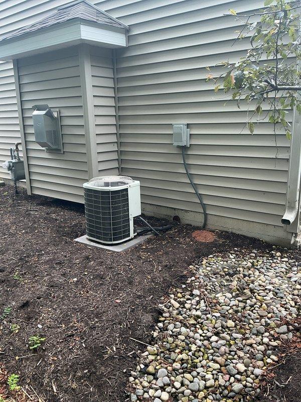 Responded to no cooling complaint and performed system evaluation. Upon inspection, found existing air conditioning system failing and unable to maintain proper cooling capacity. Provided estimate for complete HVAC system replacement. Documented existing equipment conditions including excessive condensation on indoor components indicating potential airflow restrictions and system inefficiencies. Measured and photographed indoor unit showing significant moisture accumulation on metal surfaces. Exterior condenser unit assessed and photographed showing current installation configuration with electrical connections and refrigerant line routing along exterior wall. Presented replacement options to address cooling failure and restore climate control functionality to residence.