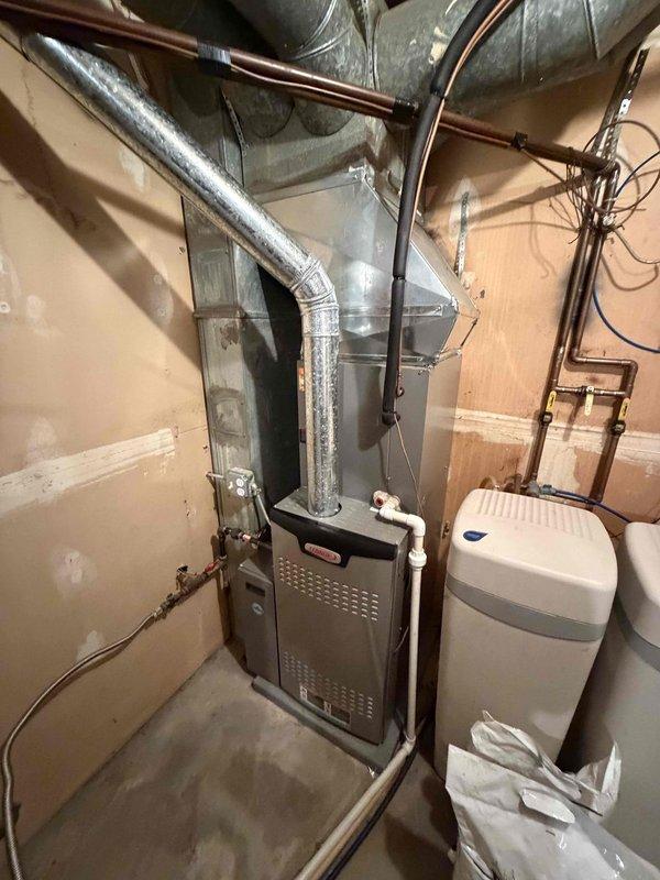 Performed comprehensive AC tune-up on residential split system. Conducted system diagnostics including temperature differential measurements across supply and return registers, verifying proper airflow and cooling performance. Inspected furnace unit, ductwork connections, and associated HVAC infrastructure in mechanical room. All components operating within normal parameters, system cooling effectively with no deficiencies noted.