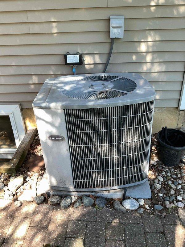 Completed scheduled cooling season maintenance on Carrier outdoor condensing unit and Val-Pak air handler system. Performed comprehensive system inspection including visual examination of condenser cabinet, fan motor operation, and electrical connections at disconnect box. Verified proper refrigerant levels and system pressures per manufacturer specifications. Inspected and cleaned condenser coil, checked fan blade condition and motor operation. Examined air handler cabinet, warning labels, and UL certification documentation. Tested electrical components, contactors, and capacitors for proper operation. Confirmed system startup and shutdown cycles functioning correctly. Unit operating within normal parameters with no deficiencies noted at time of service.