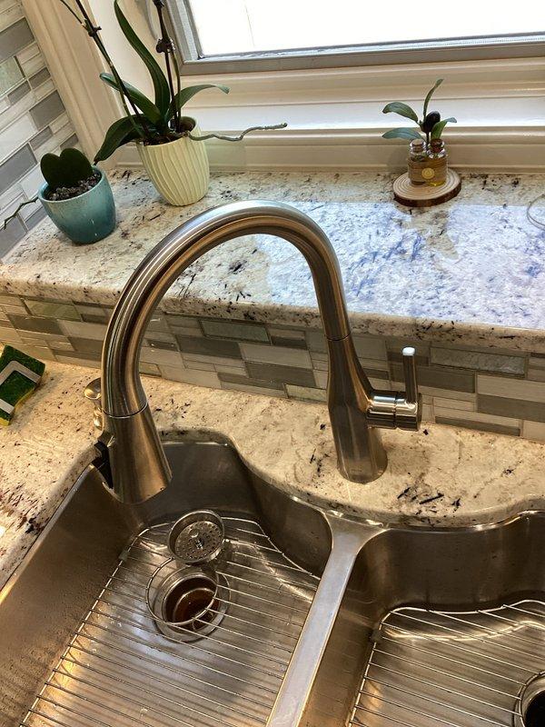 Replaced kitchen faucet with customer-supplied fixture, installing new brushed stainless steel pull-down model with high-arc spout over double-basin sink. Repaired leaking shower handle in master bathroom by replacing worn cartridge and seals. Verified all connections were secure, tested water flow and temperature control, and confirmed no leaks at both locations upon completion.