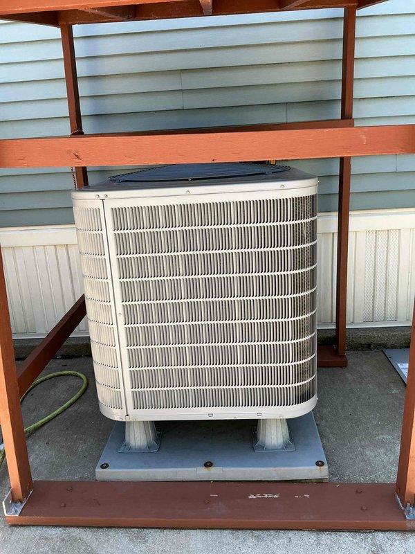 Completed first prepaid cooling maintenance visit on residential split system. Performed comprehensive inspection of outdoor condenser unit housed in wooden shelter structure and indoor air handler with Honeywell controls. Verified proper operation of both components, checked refrigerant levels, inspected electrical connections, and cleaned condenser coils. System operating within normal parameters with no issues identified.