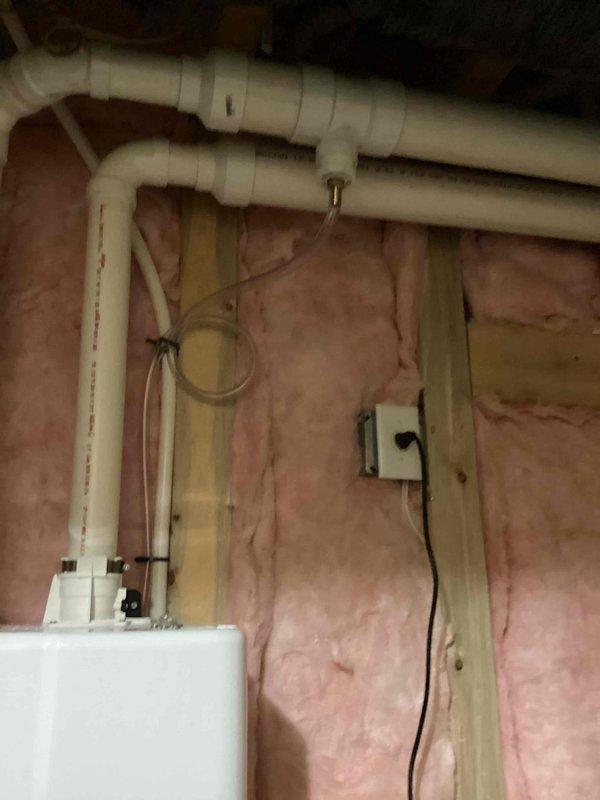 Completed warranty parts replacement on tankless water heater unit installed in attic crawl space. Replaced defective component under manufacturer warranty, with customer responsible for labor only. Verified proper operation of unit, confirmed all PVC venting and condensate drainage lines were secure and functioning correctly, and ensured electrical connections remained intact throughout the repair process.