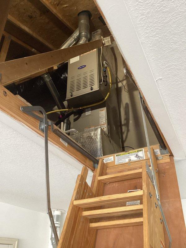 Completed full HVAC system replacement including installation of Carrier 26SCA424N003 single-stage air conditioner, Carrier CVAVA3017XMA evaporator coil, and Carrier 58TP0B070V17--16 two-stage non-condensing gas furnace in attic location. Removed and recycled existing equipment, installed new 2" PVC condenser pad with pea gravel base, and reconnected to existing supply and return ductwork. Flushed and pressure tested existing line set, installed new disconnect and whip, and reconnected all electrical connections per manufacturer specifications. System charged with 3.9 lbs R454B refrigerant per nameplate specifications. Verified proper airflow, combustion analysis, and operational performance of all components. Conducted post-installation quality assurance inspection, registered equipment warranty, and provided thermostat operation training to occupant.