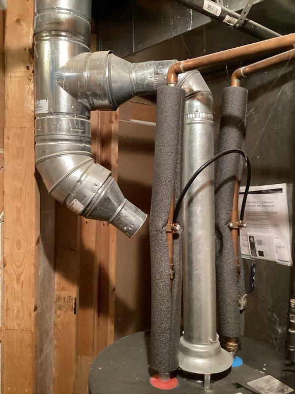 Completed estimate for replacement of gas-fired tank-type water heater in basement that had previously sustained water damage from flooding. Existing Whirlpool unit was assessed and photographed, noting current operational status despite prior water exposure. Provided replacement options and recommendations to homeowner due to potential reliability concerns from moisture infiltration affecting internal components and control systems.