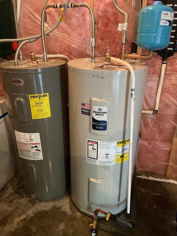 Successfully removed and replaced existing water heater with a new 40-gallon electric short water heater in walk-out basement utility room. Due to challenging access up hillside terrain, utilized two-person crew to safely extract old unit and position new equipment. Connected all supply and discharge plumbing lines, installed expansion tank, verified proper electrical connections, and tested system for leaks and proper operation. Unit is now fully functional and operational.