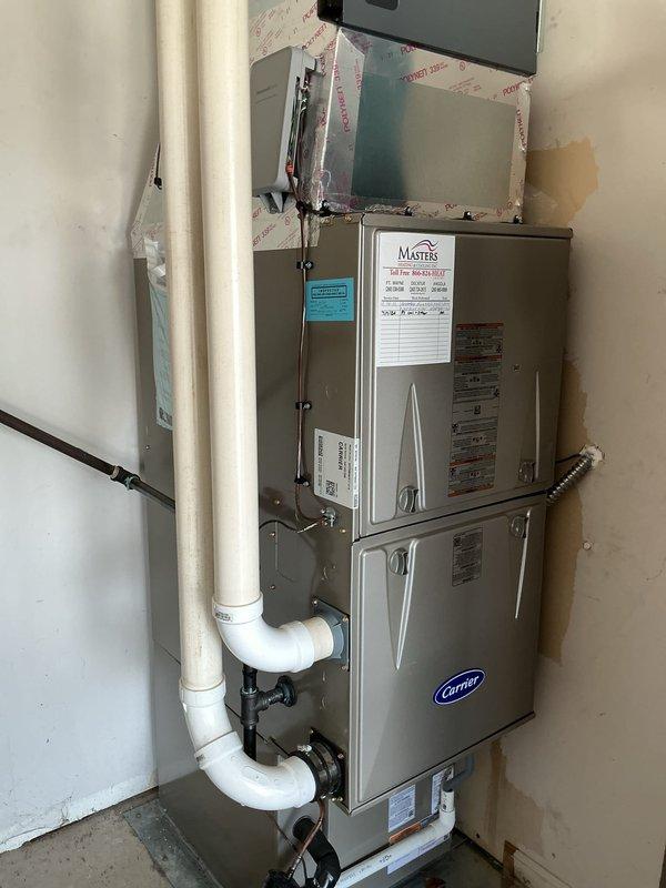 Performed comprehensive air conditioning tune-up on Carrier HVAC system. Inspected furnace unit, verified proper operation of all electrical components at breaker panel, checked PVC condensate drainage lines for proper flow and trap configuration, and examined all accessible ductwork connections. System tested and found operating within manufacturer specifications with no deficiencies noted.