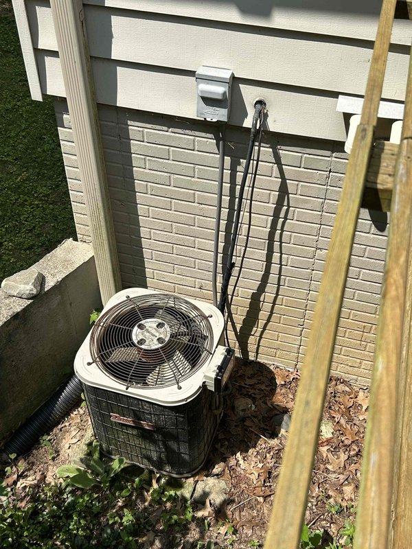 Conducted comprehensive assessment of existing HVAC system for complete replacement estimate. Evaluated basement-installed furnace with aged sheet metal ductwork and flex duct connections, along with exterior air conditioning unit featuring refrigerant line connections and electrical disconnect. Documented current equipment conditions, ductwork configuration, and installation parameters to provide accurate replacement specifications for both heating and cooling systems.