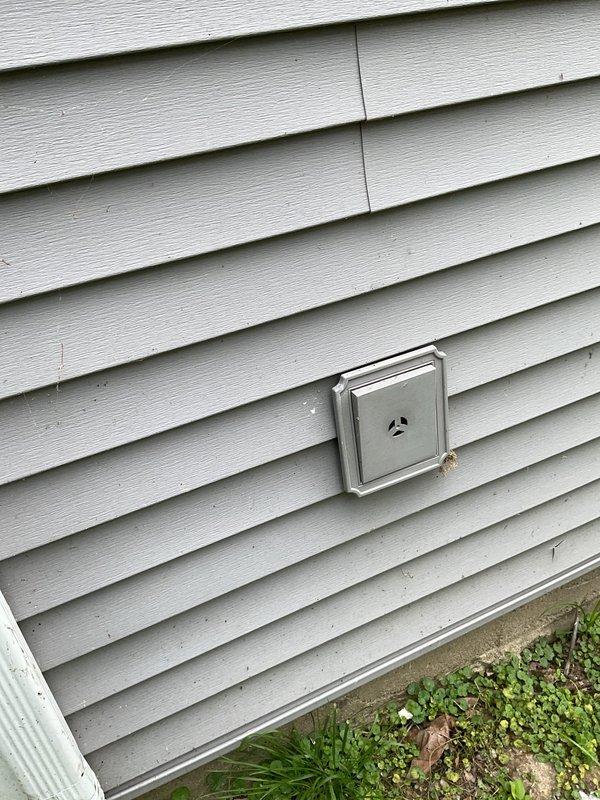 Responded to service call for outdoor spigot that was not installed during original plumbing final inspection. Upon arrival, coordinated access with property manager and conducted exterior inspection of the building. Documented existing conditions through photographs showing the exterior wall siding and utility access points. Confirmed the absence of the outdoor water spigot installation and captured detailed images of the installation location for coordination with previous work completed during plumbing final. Left communication regarding interior access to complete assessment and determine proper installation requirements for the missing exterior hose bib.