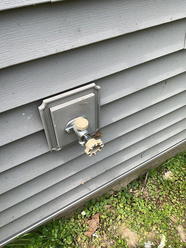 Responded to service call for outdoor spigot that was not installed during original plumbing final inspection. Upon arrival, coordinated access with property manager and conducted exterior inspection of the building. Documented existing conditions through photographs showing the exterior wall siding and utility access points. Confirmed the absence of the outdoor water spigot installation and captured detailed images of the installation location for coordination with previous work completed during plumbing final. Left communication regarding interior access to complete assessment and determine proper installation requirements for the missing exterior hose bib.