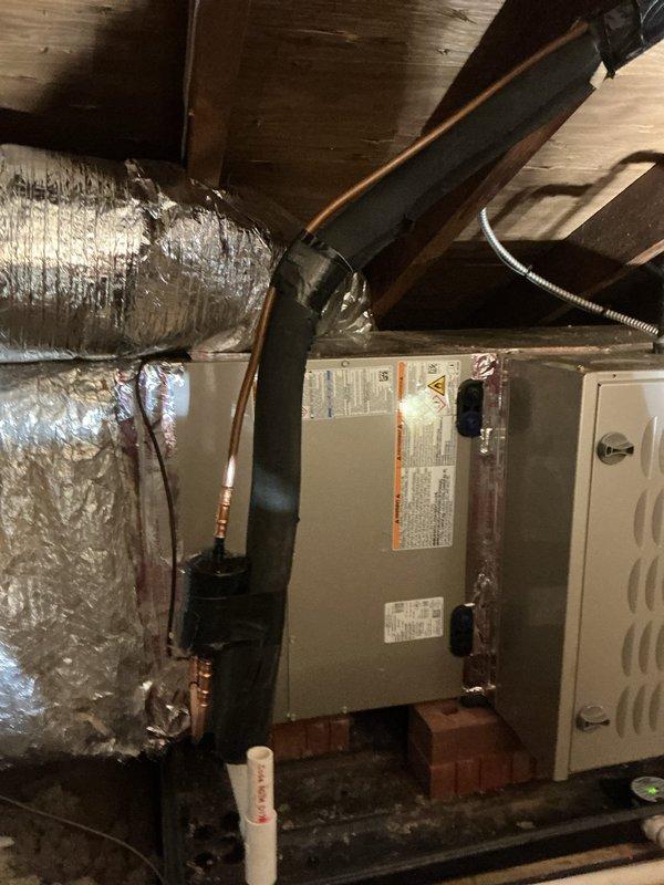 Completed full HVAC system replacement including installation of Carrier 26TPA836W003 Performance Series two-stage air conditioner, Carrier CVAVA4221XMA evaporator coil, and Carrier 58TP0B110V21-22 80% AFUE Performance Series gas furnace with two-stage gas valve and variable-speed ECM blower motor. Installed Honeywell ELITEPRO S1200 thermostat for system control. Configured horizontal attic installation with safety auxiliary drain pan and wet switch for condensate overflow protection. Mounted outdoor condensing unit on concrete pad against exterior wall with proper clearances. Installed new electrical disconnect and whip for outdoor unit. Reconnected existing supply and return ductwork to new air handler. Removed and properly disposed of old HVAC equipment. Protected work areas with floor savers and performed complete cleanup of installation area. Verified all electrical connections, refrigerant charge, gas line connections, and condensate drainage. Tested system operation through mult