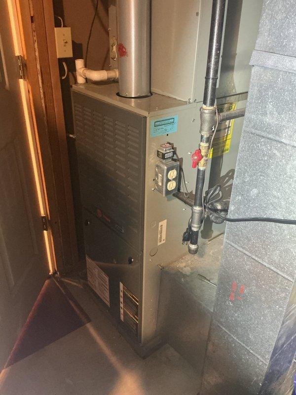 Completed diagnostic evaluation of existing HVAC system including basement-installed furnace and outdoor condensing unit. Documented current equipment condition and configuration, photographed indoor furnace installation with refrigerant lines and ductwork, and exterior AC unit with electrical connections. Scheduled estimate appointment for complete system replacement to address identified equipment failure.