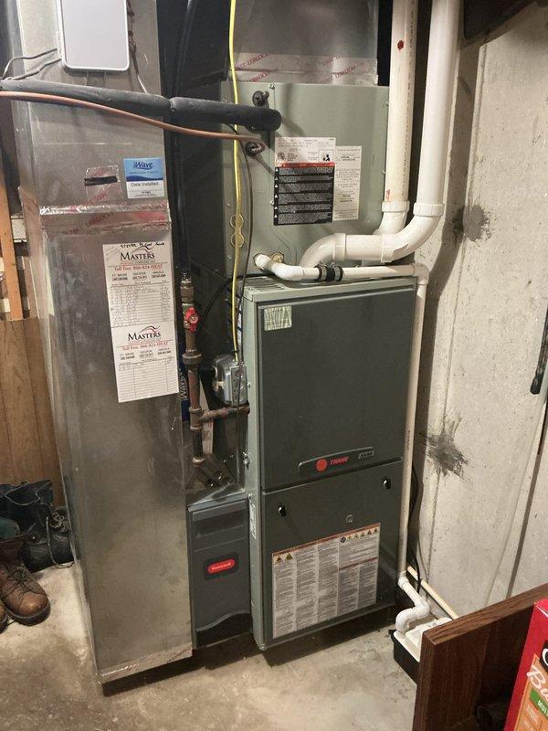Responded to diagnostic service call for HVAC system evaluation. Conducted comprehensive assessment of existing Trane furnace and air handler system located in basement utility area. Documented current equipment specifications, measurements, and overall system condition through detailed photography for replacement estimate preparation. Coordinated scheduling for sales consultation to provide customer with equipment replacement options and pricing.