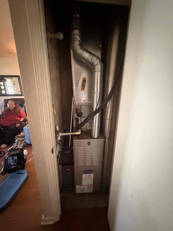 Completed final prepaid cooling maintenance visit for duplex property with two separate HVAC systems. Performed standard preventive maintenance inspection on Carrier furnace and cooling system located in utility closet, verified electrical connections at terminal block were secure with proper wire terminations, and documented equipment condition through photographs. Both residential units serviced per maintenance agreement, with coverage extending through October 2026.