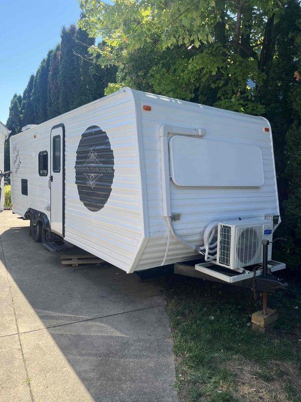 Responded to no cooling complaint on Rovsun 9,000 BTU mini-split system with R32 refrigerant installed in recreational vehicle used as cigar bar. Upon arrival, performed diagnostic evaluation of ductless unit mounted in camper interior. Conducted system inspection, checked refrigerant charge levels (2# maximum capacity), tested electrical connections, and verified thermostat operation. Identified and resolved cooling issue, restoring proper system function. Unit operating normally at time of departure.