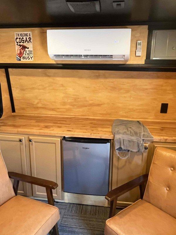 Responded to no cooling complaint on Rovsun 9,000 BTU mini-split system with R32 refrigerant installed in recreational vehicle used as cigar bar. Upon arrival, performed diagnostic evaluation of ductless unit mounted in camper interior. Conducted system inspection, checked refrigerant charge levels (2# maximum capacity), tested electrical connections, and verified thermostat operation. Identified and resolved cooling issue, restoring proper system function. Unit operating normally at time of departure.