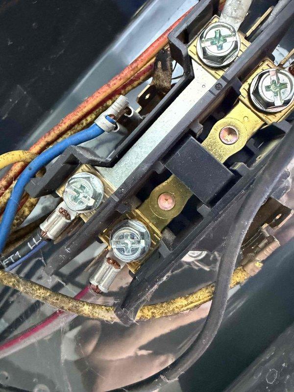 Completed air conditioning tune-up service including comprehensive system inspection and performance evaluation. Documented electrical connections and capacitor condition, noting age-related wear on terminal blocks and wiring with visible corrosion on connections and mounting hardware. All critical components photographed for service records, with dual capacitor and contactor assembly showing normal operational wear consistent with system age.