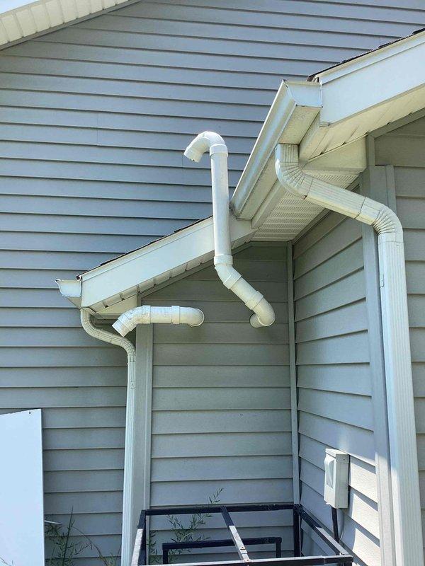 Responded to service call for tankless water heater reported as non-operational. Upon arrival, performed diagnostic evaluation of the unit and exhaust venting system. Inspected the exterior-mounted PVC exhaust/intake piping configuration for proper installation, clearances, and potential blockages. Verified venting termination points were properly positioned and free from obstructions. Assessed unit functionality and determined cause of operational failure. Completed necessary repairs to restore hot water service. Confirmed proper combustion air supply and exhaust discharge. Tested unit through complete heating cycle to verify restoration of normal operation. System returned to full working condition with proper venting and safe operation confirmed.