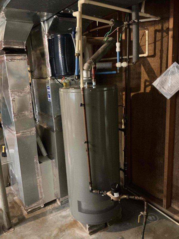 Completed comprehensive air conditioning tune-up service at residential property. Performed standard maintenance procedures including inspection of furnace and air handler unit in basement mechanical room, verified proper operation of HVAC system components, checked refrigerant levels, cleaned condenser coils, and inspected all electrical connections and controls. System tested and confirmed operating within manufacturer specifications with no deficiencies noted.