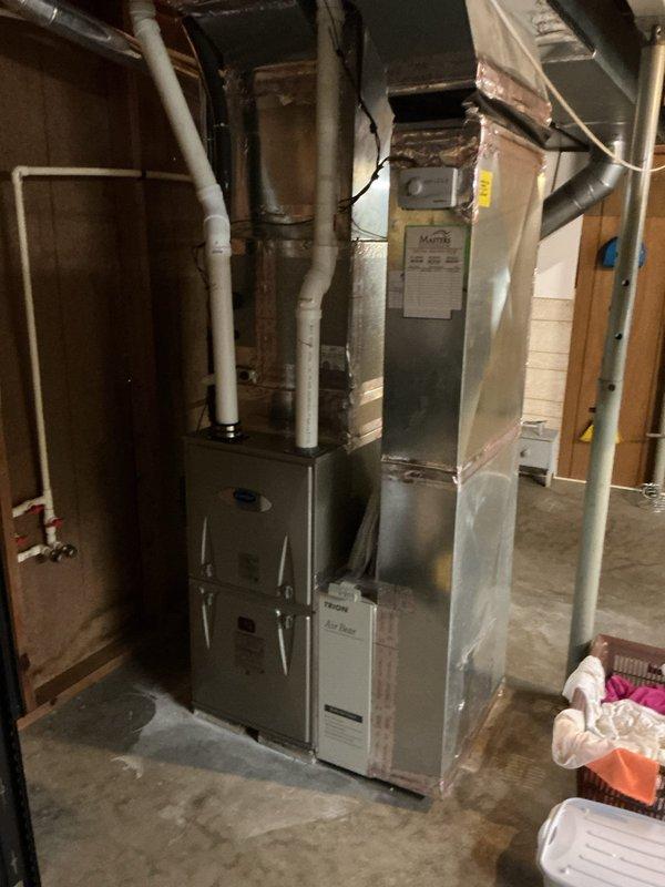Completed comprehensive air conditioning tune-up service at residential property. Performed standard maintenance procedures including inspection of furnace and air handler unit in basement mechanical room, verified proper operation of HVAC system components, checked refrigerant levels, cleaned condenser coils, and inspected all electrical connections and controls. System tested and confirmed operating within manufacturer specifications with no deficiencies noted.