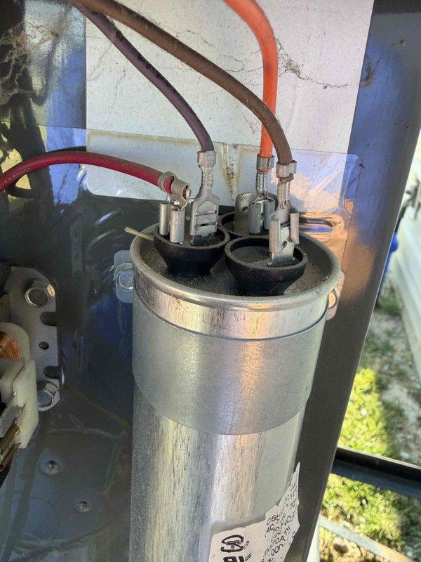 Completed comprehensive air conditioning tune-up on residential HVAC system. Performed electrical diagnostics using digital multimeter to verify proper voltage and capacitance readings at the air handler unit. Inspected and tested run capacitor connections, confirming all wire terminals were secure and electrical components were functioning within manufacturer specifications.