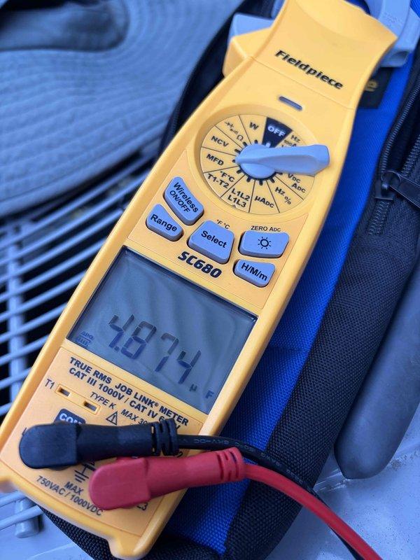Completed prepaid cooling maintenance visit on residential HVAC system. Performed standard seasonal inspection including electrical testing with clamp meter, which showed normal amperage draw at 48.74 amps. Inspected condensing unit components, capacitor connections, contactor operation, and verified all electrical terminations were secure. System operating within manufacturer specifications.