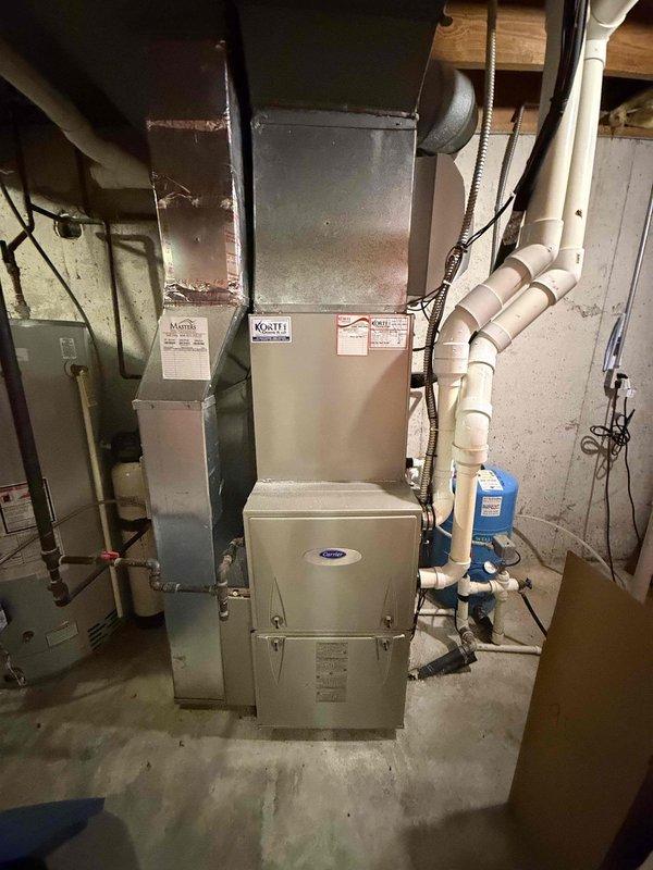Completed scheduled preventive maintenance inspection on residential cooling system as part of prepaid maintenance agreement. Performed comprehensive evaluation of indoor furnace unit with integrated cooling coil, condensate drainage system with pump, and outdoor condenser unit. Inspected all components including heat exchanger coils, refrigerant lines, electrical connections, and condensate management system; verified proper operation of all equipment and documented system condition with photographs.