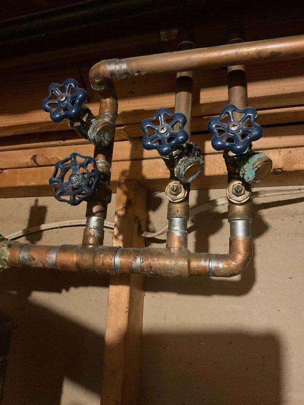 Performed comprehensive plumbing maintenance service on a 50-gallon gas-fired tanked water heater manufactured in 2007. Completed standard water heater flush procedure to remove sediment buildup and maintain optimal system performance. Inspected unit for the reported minor leak, examining all connections, fittings, and tank integrity. Documented existing copper plumbing manifold system with multiple shut-off valves showing age-appropriate patina and minor oxidation on brass components. Verified power vent configuration and assessed overall system condition. Water heater features EverKleen self-cleaning technology and flammable vapor resistant design with 38,000 BTU input capacity. All maintenance procedures completed per manufacturer specifications to ensure continued safe and efficient operation of the domestic hot water system.