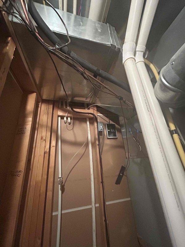 Conducted site evaluation for additional HVAC unit installation in residential property. Assessed existing basement mechanical room infrastructure, including current furnace/air handler configuration, ductwork routing, and available space for secondary system placement. Documented existing PVC drainage lines, electrical service capacity, and structural framing to determine optimal equipment positioning. Provided comprehensive equipment options including cooling-only, heating-only, and combination heat pump systems to meet homeowner requirements. Evaluated electrical panel capacity and discussed installation considerations for adding supplemental climate control to expand conditioned living space.