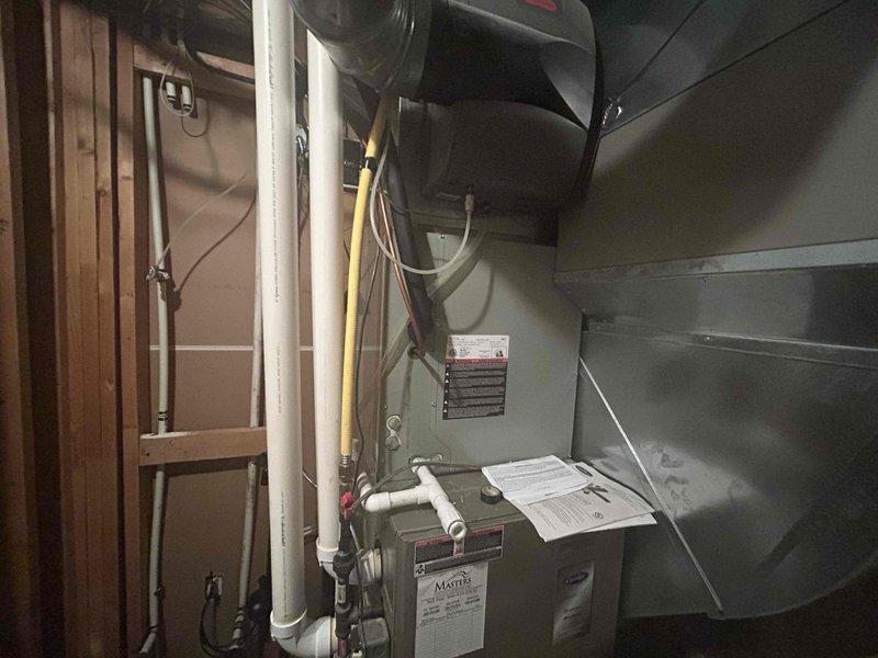 Conducted site evaluation for additional HVAC unit installation in residential property. Assessed existing basement mechanical room infrastructure, including current furnace/air handler configuration, ductwork routing, and available space for secondary system placement. Documented existing PVC drainage lines, electrical service capacity, and structural framing to determine optimal equipment positioning. Provided comprehensive equipment options including cooling-only, heating-only, and combination heat pump systems to meet homeowner requirements. Evaluated electrical panel capacity and discussed installation considerations for adding supplemental climate control to expand conditioned living space.