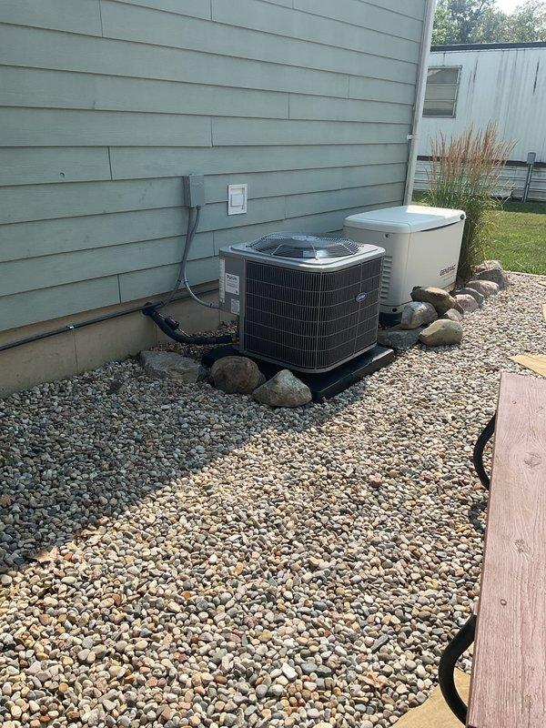 Completed full system installation of Carrier Comfort Series 26SCA436N003 single-stage air conditioning condenser unit with matching Carrier CVAVA3617XMA mobile home evaporator coil at residential property. Removed and properly recycled existing HVAC equipment in accordance with EPA refrigerant recovery regulations.

Installed new condenser unit on 2-inch PVC pad with pea gravel base for proper drainage and equipment support. Reconnected unit to existing refrigerant line set after performing complete system flush and pressure test to verify integrity and absence of leaks. Installed new electrical disconnect box and whip to meet current electrical code requirements. Ran and secured refrigerant lines along exterior wall using appropriate hangers and protection.

Inside the residence, installed mobile home-specific evaporator coil and reconnected to existing supply and return ductwork. Verified all duct connections were properly sealed and secured. Installed Honeywell FocusPro S200 progra