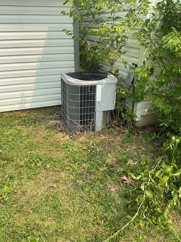 Responded to no-cool complaint on residential air conditioning system. Evaluated existing Trane HVAC system with failed compressor utilizing R22 refrigerant. Documented indoor furnace unit installed in utility closet and outdoor condensing unit positioned on exterior side yard. Photographed current equipment configuration including refrigerant line routing, electrical connections, and installation clearances. Provided estimate for complete system replacement due to obsolete R22 refrigerant and failed compressor making repair economically unfeasible. Discussed financing options with customer for new equipment installation.