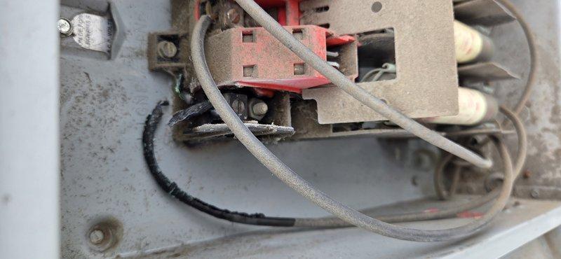 Responded to no cooling complaint on two HVAC units serving showroom and drive-thru areas. Upon arrival, inspected both units and identified electrical connection issues at control panels. Examined wiring terminals, junction points, and mounting brackets showing age-related deterioration with significant dust and grime accumulation. Cleaned and secured loose electrical connections including multiple wire circuits at terminal blocks. Verified proper wire routing and connection integrity at control boxes. Tested system operation after repairs, confirming both units restored to normal cooling function.