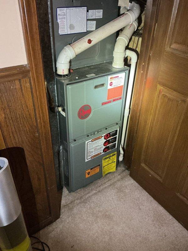 Responded to no cooling complaint and conducted comprehensive assessment of existing Rheem HVAC system. Evaluated both air conditioning unit and furnace to determine cause of cooling failure and provide replacement estimate. Documented current equipment condition including furnace installation in utility closet with PVC venting, ductwork configuration, and overall system setup. Photographed existing Rheem equipment showing age-related wear and provided customer with detailed replacement options to restore cooling capability to residence.