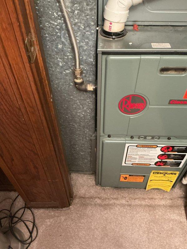 Responded to no cooling complaint and conducted comprehensive assessment of existing Rheem HVAC system. Evaluated both air conditioning unit and furnace to determine cause of cooling failure and provide replacement estimate. Documented current equipment condition including furnace installation in utility closet with PVC venting, ductwork configuration, and overall system setup. Photographed existing Rheem equipment showing age-related wear and provided customer with detailed replacement options to restore cooling capability to residence.