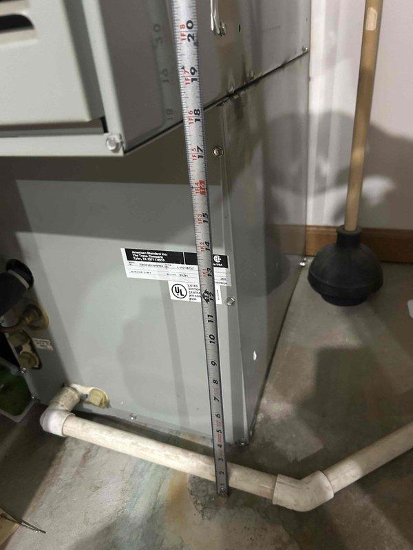 Responded to no cooling complaint and performed comprehensive assessment of existing HVAC system. Documented current equipment configuration including air handler unit and associated plumbing connections. Measured and photographed existing installation to provide accurate replacement estimate. System evaluation confirmed air conditioning component requires replacement while existing furnace remains operational per occupant feedback. Prepared detailed documentation including equipment specifications, clearance measurements, and existing utility connections for replacement proposal.