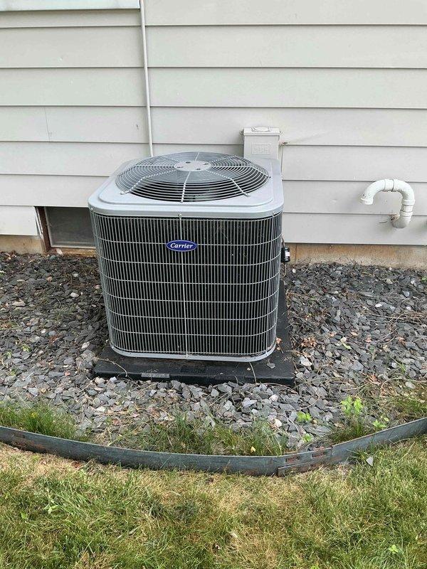 Completed scheduled cooling maintenance on Carrier split system. Inspected outdoor condenser unit and indoor furnace, verified proper operation of all components, checked refrigerant lines and condensate drainage, and documented system condition with photographs. All equipment operating within normal parameters.