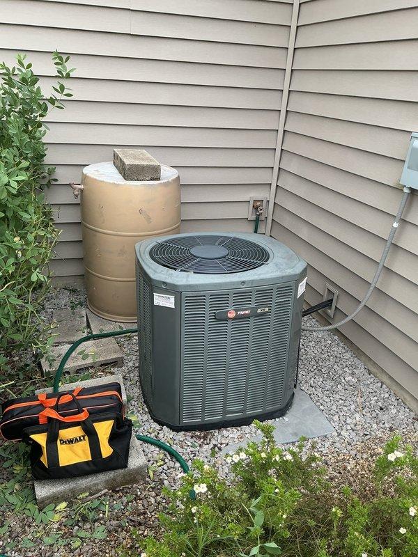 Completed preventive maintenance tune-up on Trane air conditioning system. Inspected outdoor condenser unit, verified proper operation of compressor and fan motor, checked refrigerant levels, cleaned coils, and tested electrical connections. All components found to be operating within normal parameters with no issues identified.