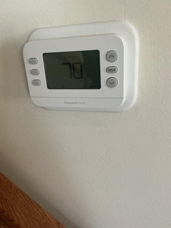 Completed HVAC estimate for replacement of existing geothermal system with conventional non-geothermal heating and cooling equipment. Assessed current mechanical room setup including wall-mounted air filtration unit, existing ductwork infrastructure, and thermostat controls to determine specifications and requirements for new system installation.