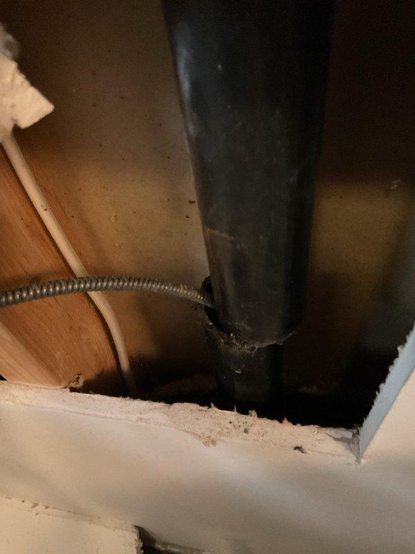 Responded to reported water leak initially attributed to dishwasher but identified actual source as corroded copper waterlines serving the washing machine. Performed comprehensive plumbing repair including removal of outdated washer box and deteriorated copper supply lines. Cut drywall access panel to expose and extract existing washer box and corroded piping running between floors.

Installed new washer box with PEX adapters and ran new supply lines through floor penetration into basement. Reconnected new PEX lines to existing copper plumbing in basement. Performed thorough drain snake service on washing machine drain line to ensure complete clearance and prevent future backup issues.

Replaced leaking utility sink faucet in laundry area to eliminate active water damage concern. Upgraded water heater shut-off valves by removing outdated gate valves and installing new ball valves for improved reliability and ease of operation. All work completed to code with proper connections and leak