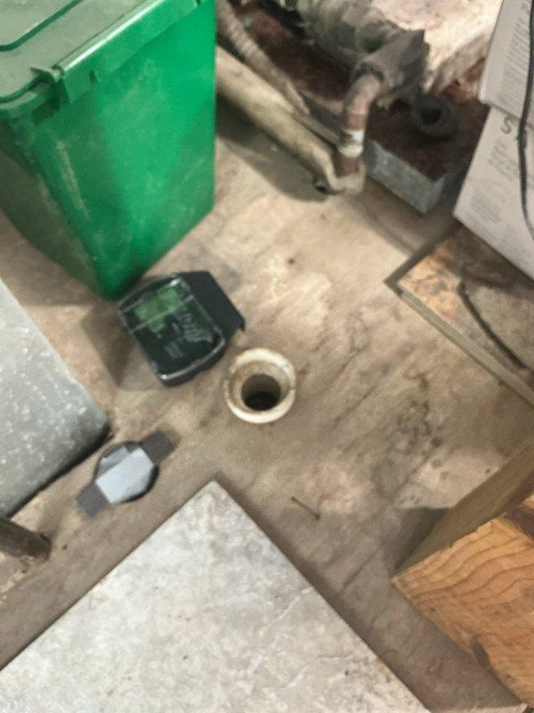 Conducted on-site evaluation of 28-year-old HVAC system and existing tanked water heater for complete replacement estimate. Assessed exterior condensing unit with cylindrical housing, refrigerant line routing, and interior mechanical space including floor drain and existing plumbing infrastructure. Provided comprehensive estimate for full system replacement including transition from tanked to tankless water heater configuration.