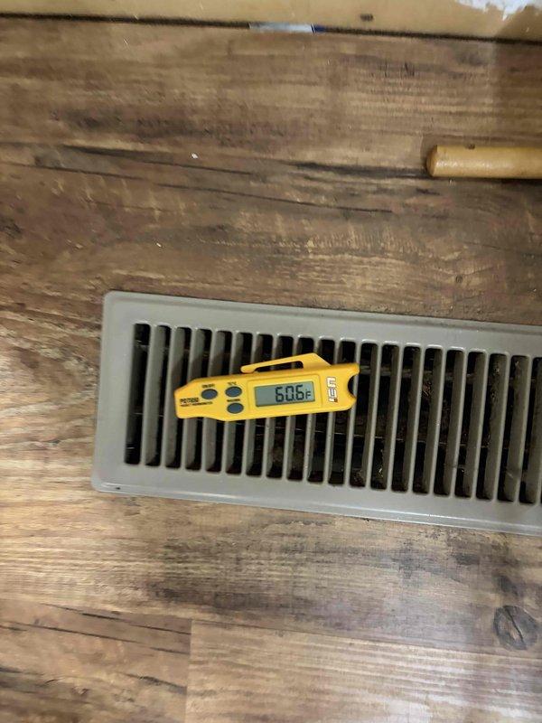 Performed standard cooling season tune-up on residential air conditioning system. Conducted comprehensive system inspection including temperature differential measurements, verifying supply air temperature at floor register reading 50.6°F and return air temperature at 82.9°F, indicating proper system operation with approximately 32°F temperature split. All components operating within normal parameters.