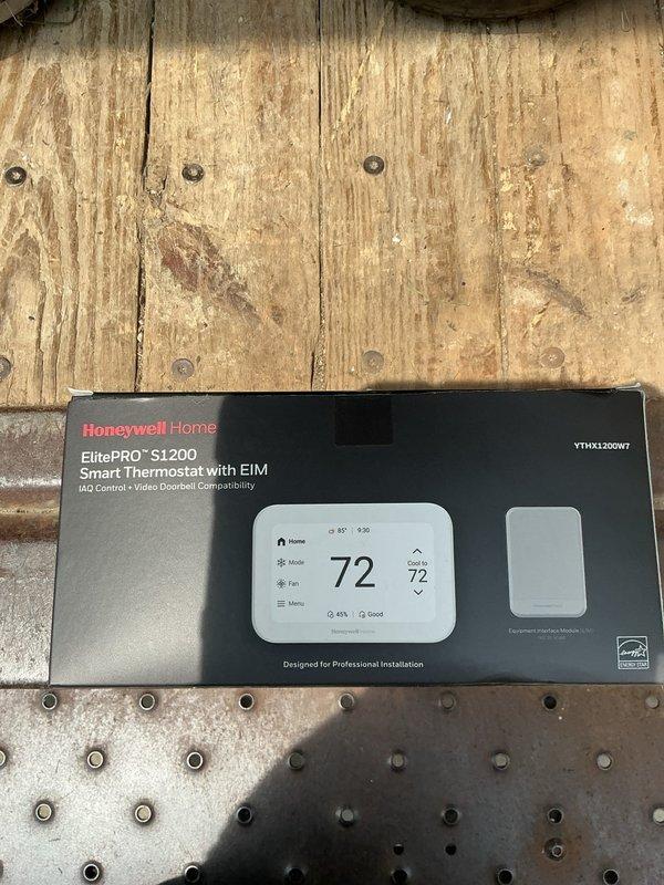 Completed full HVAC system installation including outdoor condensing unit model 26SCA442N003 positioned on gravel pad with proper drainage and clearances against exterior wall. Installed indoor air handler unit model CVAVA4821XMA with refrigerant line set connections, ensuring proper insulation and routing of copper lines. Upgraded thermostat to Honeywell Home ElitePRO S1200 Smart Thermostat with IAQ control compatibility, programmed for optimal system operation and connected to HVAC equipment. Verified all electrical connections, tested system startup and operation, confirmed proper airflow and refrigerant charge levels, and ensured all safety controls functioning correctly.
