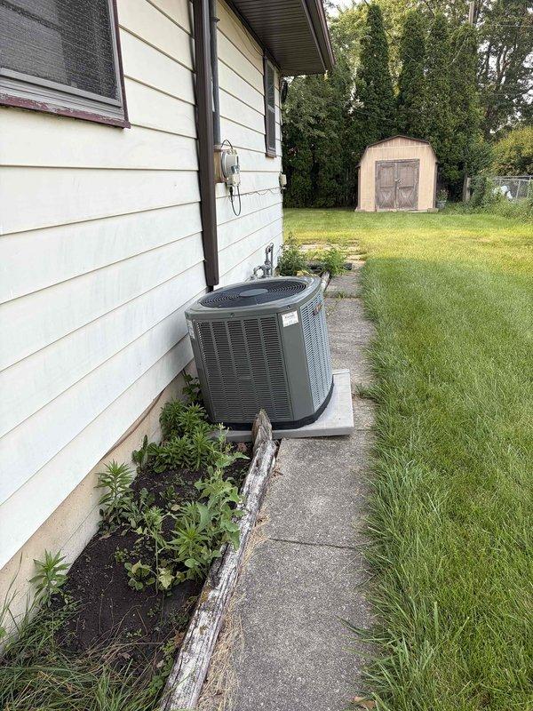 Responded to no cooling complaint on residential air conditioning system with history of refrigerant leak from 2017. Upon arrival, performed diagnostic evaluation of outdoor condensing unit and indoor evaporator coil system. Utilized electronic leak detection equipment to inspect refrigerant circuit and identify source of system failure. Documented equipment condition with photos showing outdoor condenser unit and leak detection process at indoor coil assembly.