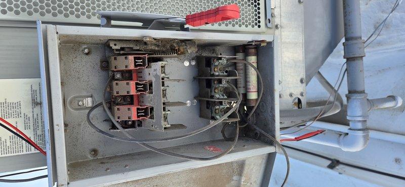 Responded to no cooling call on 10+ year old rooftop unit. Upon inspection, found failed 50 amp 600V fuses in the main disconnect. Replaced all three TRS350R fuses, verified proper electrical connections, and tested contactors for proper operation. Unit restored to normal cooling operation with all electrical components functioning within specifications.