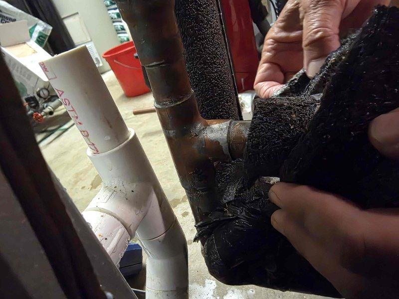Responded to service call regarding geothermal system valve component. Inspected heavily corroded brass pipe fittings and connections showing significant oxidation and deterioration. Assessed condition of existing foam pipe insulation on mechanical components and documented current state of plumbing connections for parts ordering and follow-up repair scheduling.