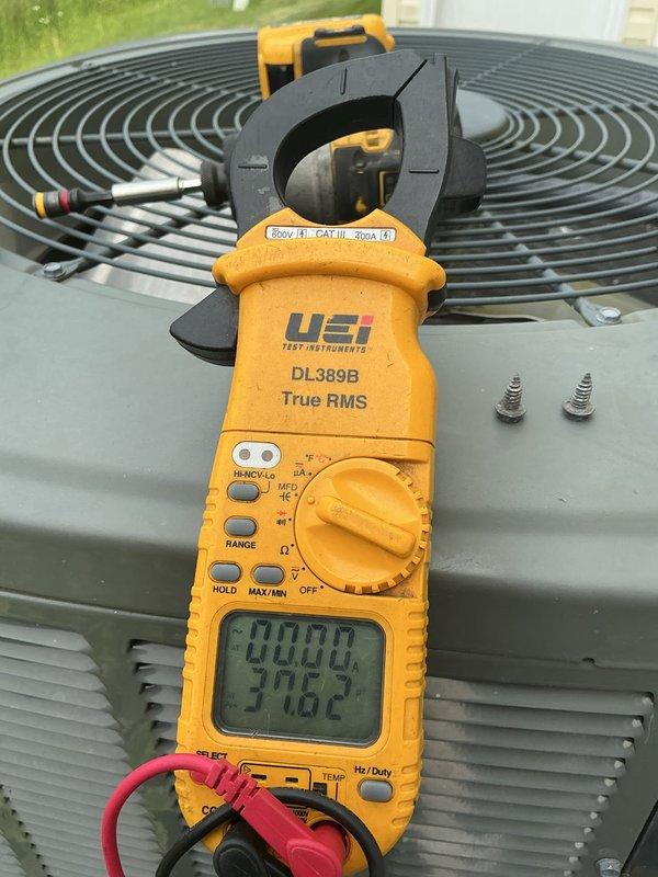 Completed preventative maintenance inspection on Trane 4TTAR30G1000AA residential cooling system. Performed electrical diagnostics using clamp meter to verify proper amperage draw and voltage supply to outdoor condensing unit. Inspected Genteq motor assembly model D15G69P16, confirmed proper operation and secure electrical connections at wire terminals. Verified condenser fan motor functionality, checked capacitor connections, and ensured all components operating within manufacturer specifications. System tested and running efficiently at time of service completion. This visit fulfilled the final prepaid maintenance appointment under current membership agreement.