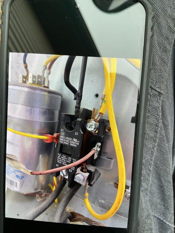 Responded to no cooling complaint on commercial HVAC unit with tripped breaker that would not reset. Upon inspection, found failed contactor with severely corroded copper bus bars and terminals preventing proper electrical operation. Replaced defective contactor with new unit, restored power, and verified system operation.