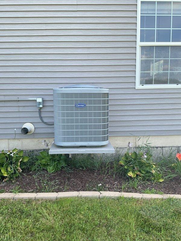 Completed comprehensive cooling system preventive maintenance tune-up on Carrier outdoor condensing unit. Performed thorough inspection of all components including condenser coil, refrigerant levels, electrical connections, and operational controls. Unit is operating within manufacturer specifications with proper airflow and clearances maintained around equipment; landscaping appropriately positioned to ensure adequate ventilation and serviceability.